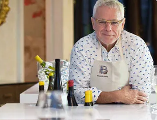 david bouley sitting at a table.