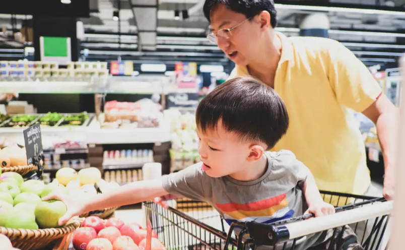 Father and son with produce
