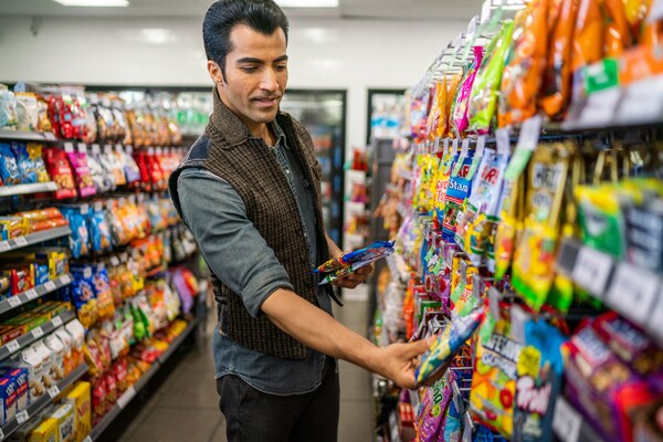 Man picking out products at 7-Eleven